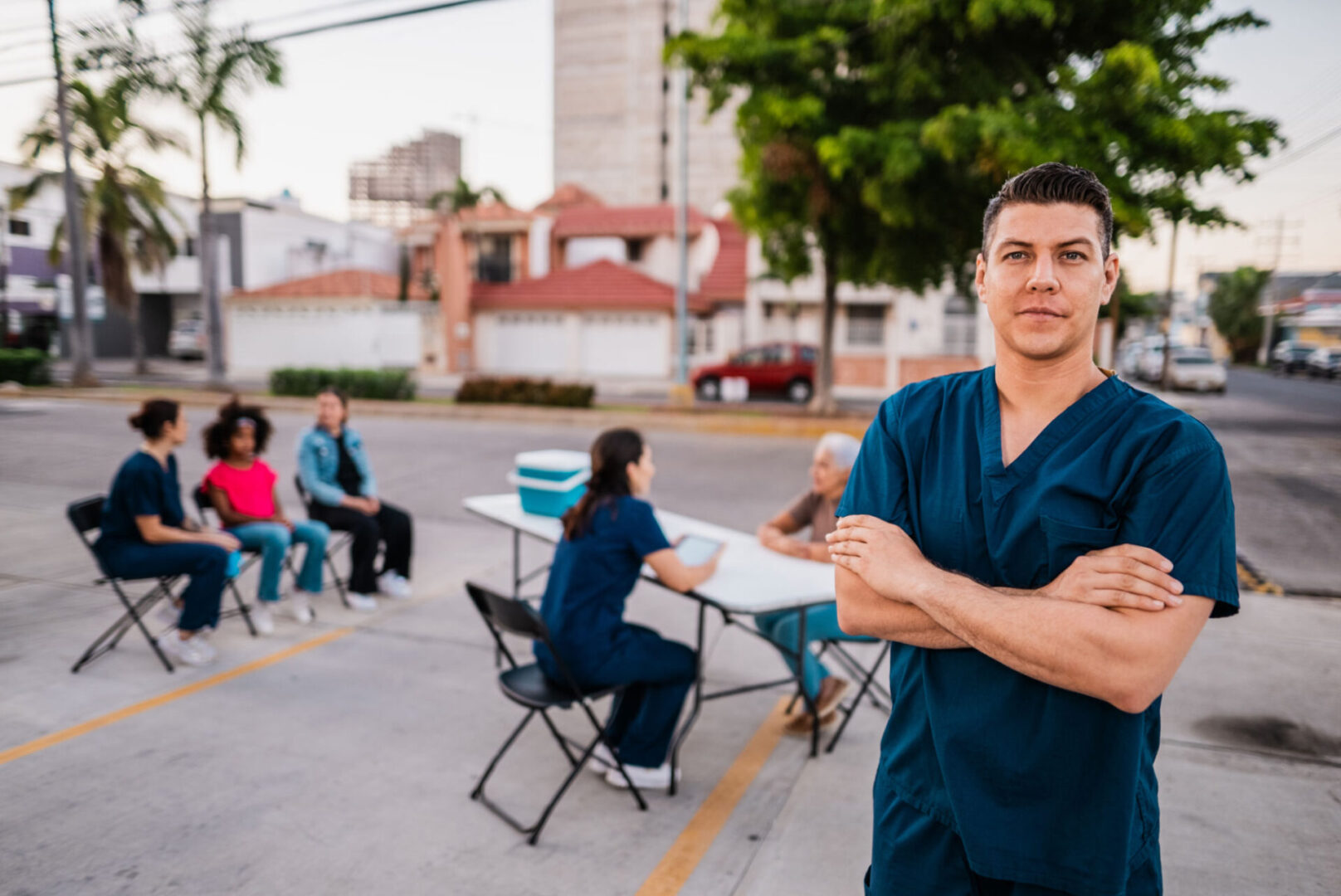 Healthcare worker at outdoor community vaccination site.